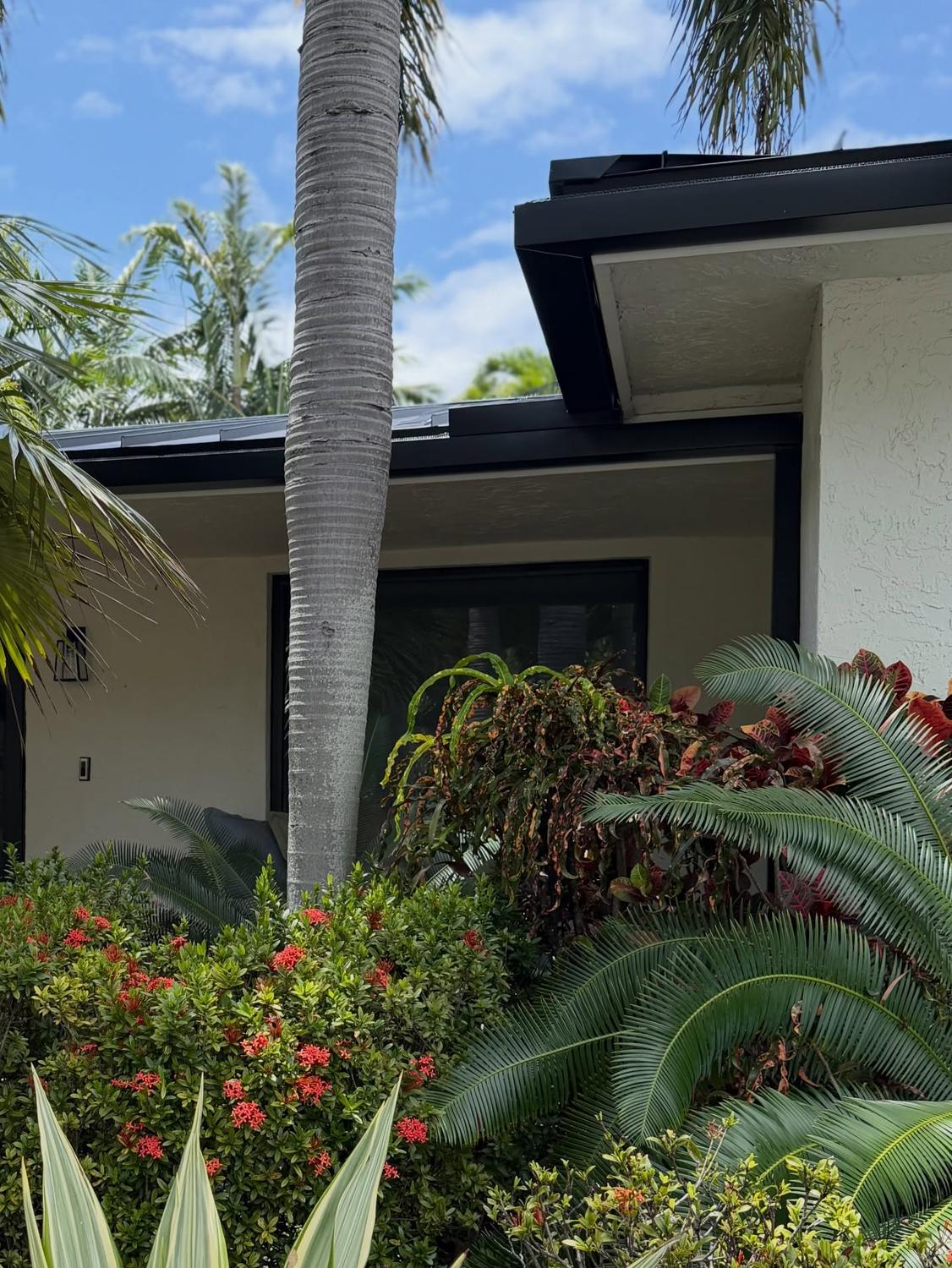 Continuous seamless gutter line along a modern home